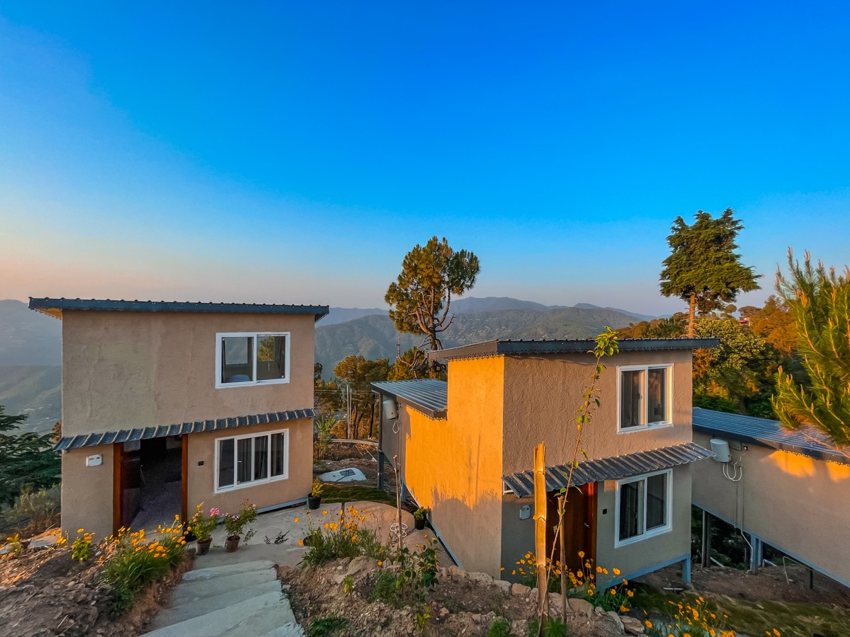 The Moksha Retreat cottages at golden hour
