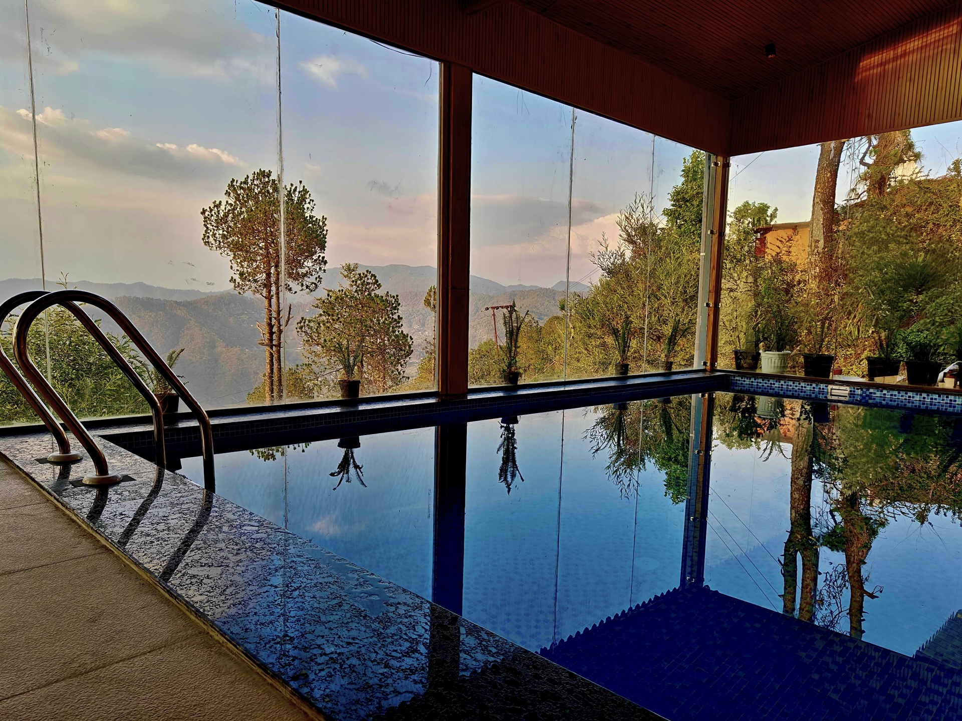 Indoor pool with mountain view at The Moksha Retreat