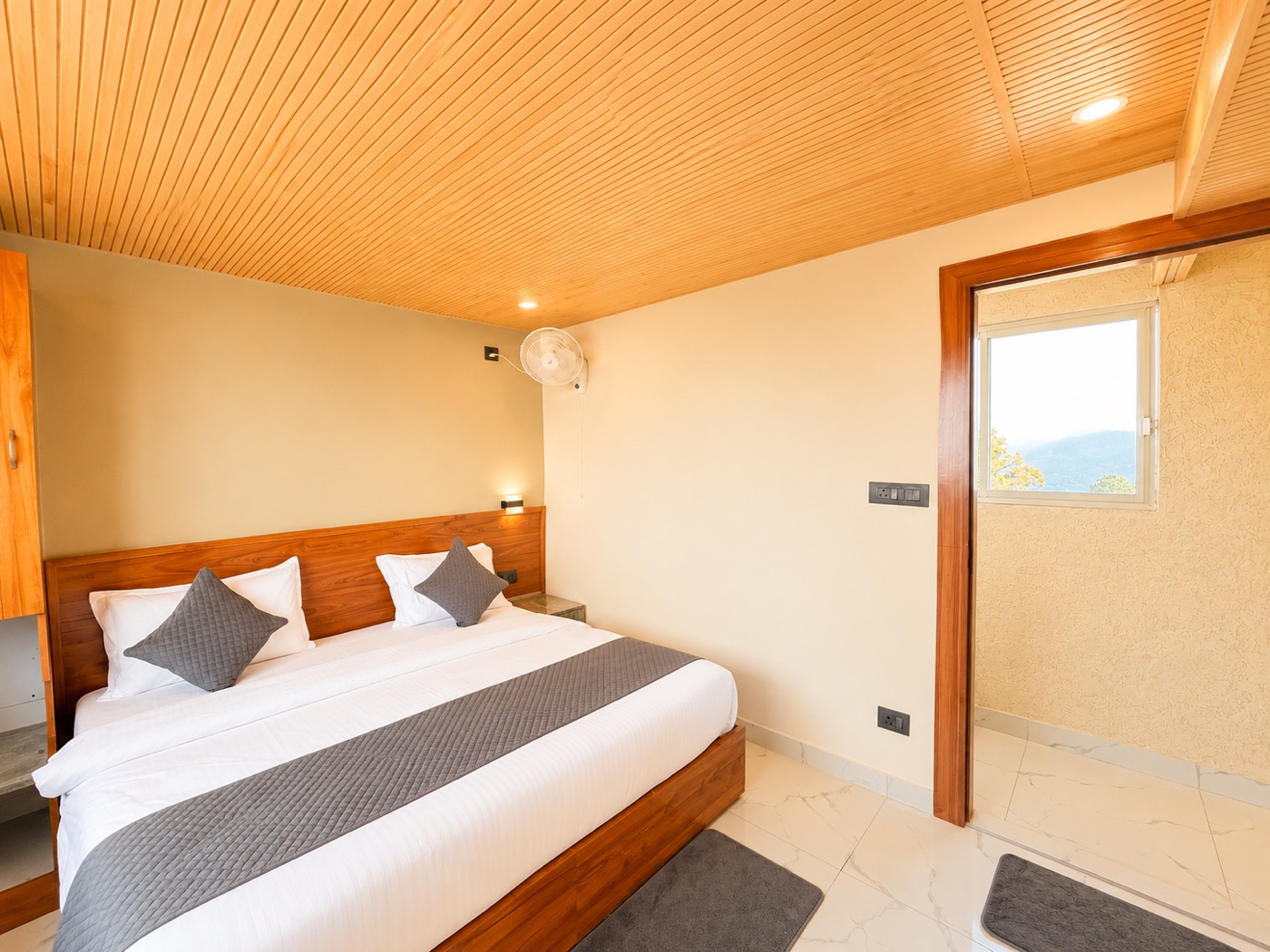 Deluxe Valley View cottage bedroom with mountain and tree view